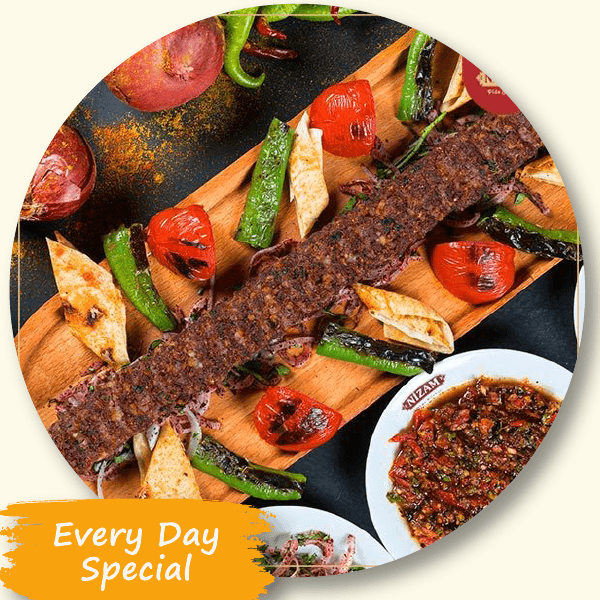 Charcoal-grilled kebab with peppers, tomatoes, flatbread and ezme